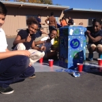 Painting recycling cans to beautify our campus.