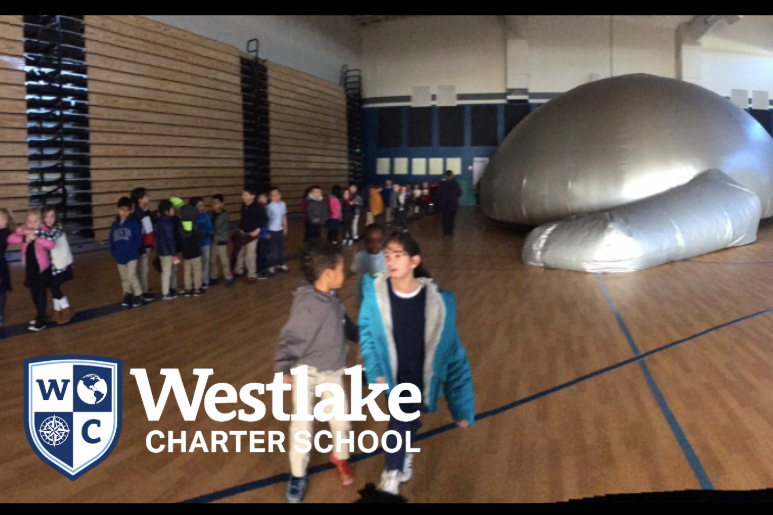 First grade students got to explore the solar system in the Sky Dome Planetarium, right in our very own gymnasium!