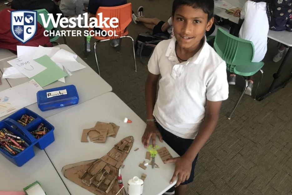 Our BASE 5th through 8th grade students have the freedom to let their imaginations soar! Like this student who is building a rocketship out of recycled cardboard.